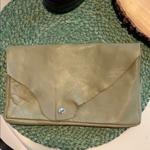 Handmade leather clutch bag.